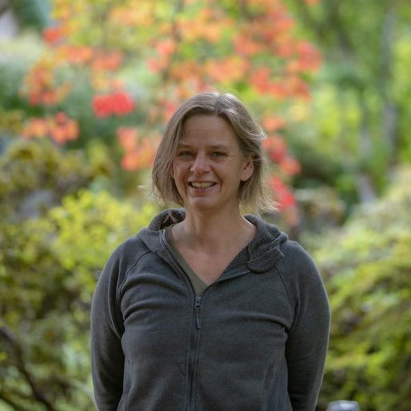 Woman standing in garden posing for a staff photo