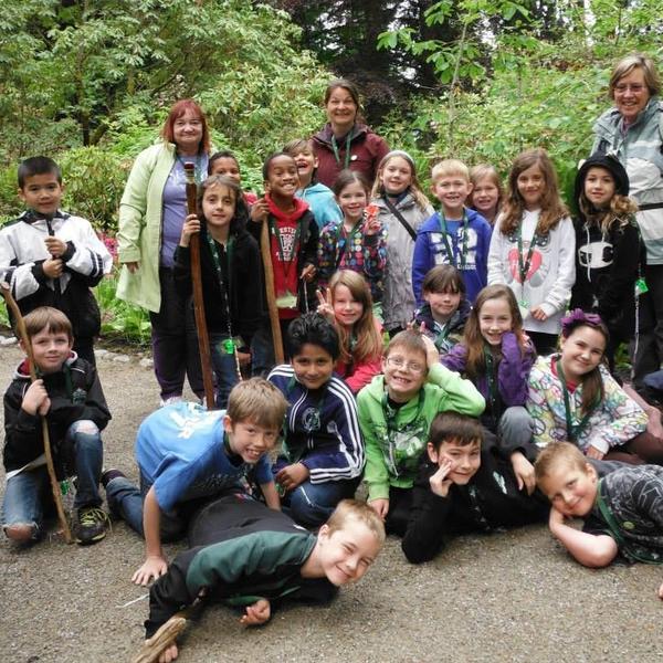 A school group poses together in the garden 