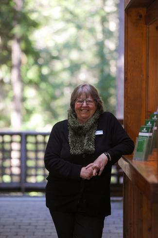 Woman standing and welcoming visitors